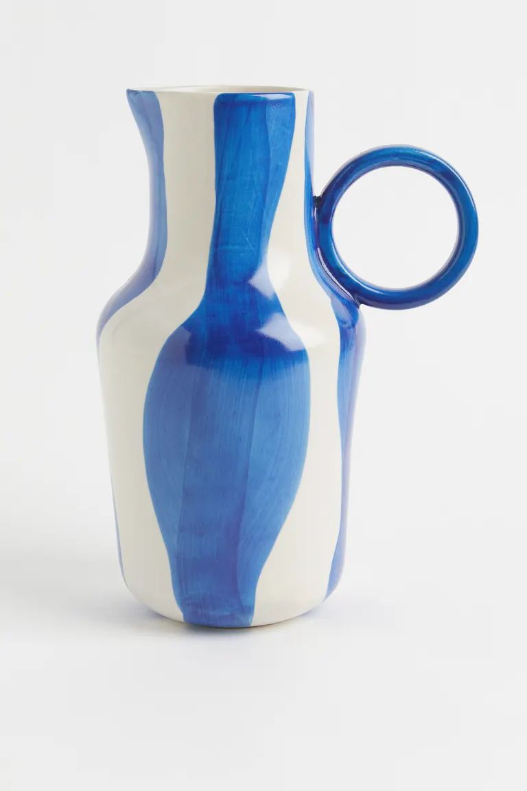 Hand-painted ceramic jug with a round handle and a spout. Height 30.5 cm.CompositionTerracotta 10... | H&M (US + CA)