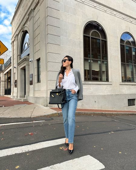 Kat Jamieson wears relaxed fit straight leg jeans, a white button down and grey blazer with pumps. Hermes Kelly bag, workwear, office style, meetings, neutral outfit. 

#LTKHoliday #LTKshoecrush #LTKSeasonal