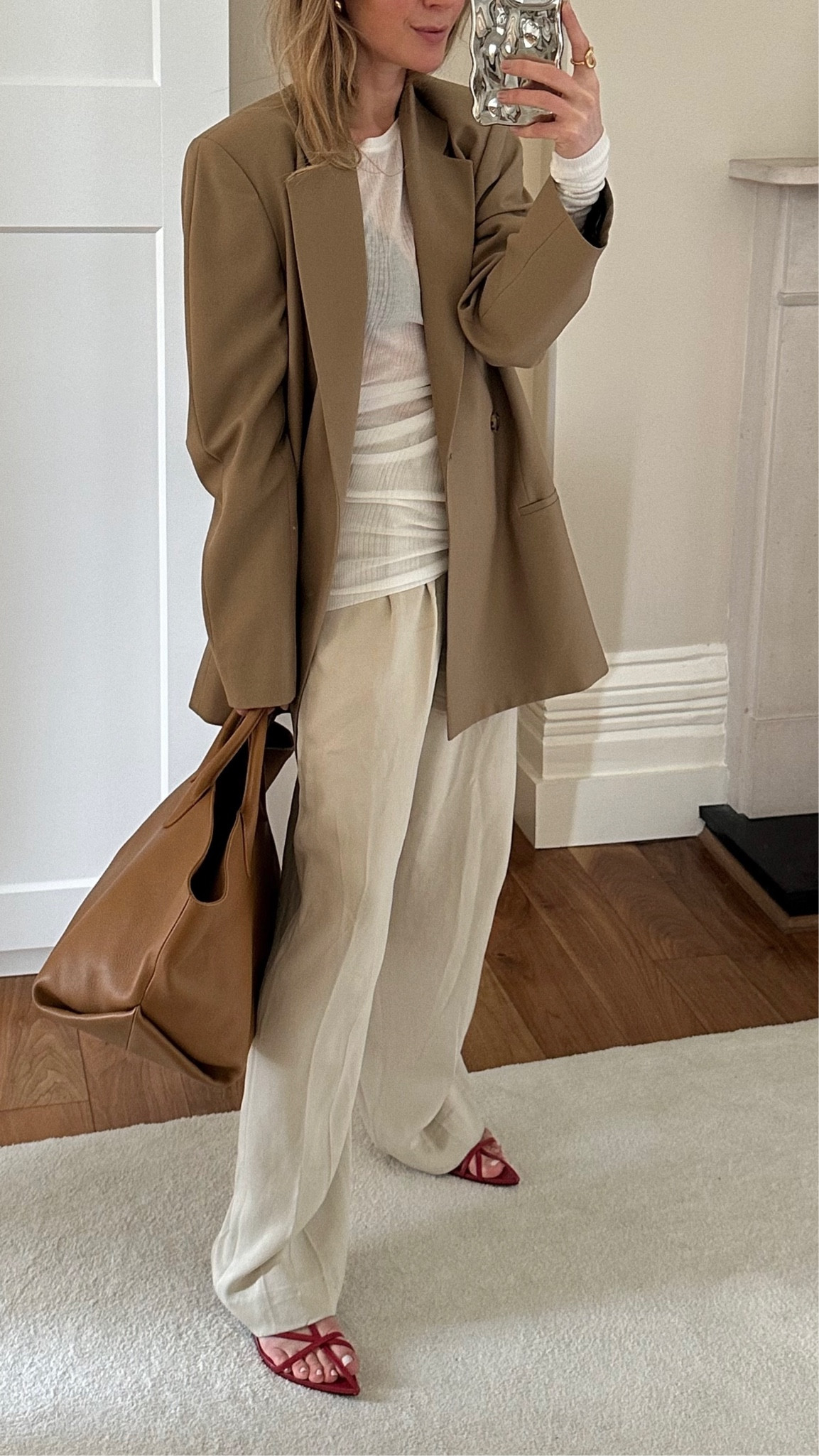 Spring outfit 
Neutral tones
Toteme 
Dagmar 
Khaite 
Jil Sander red sandals 
Mytheresa 
LVR

#LTKstyletip #LTKworkwear #LTKeurope