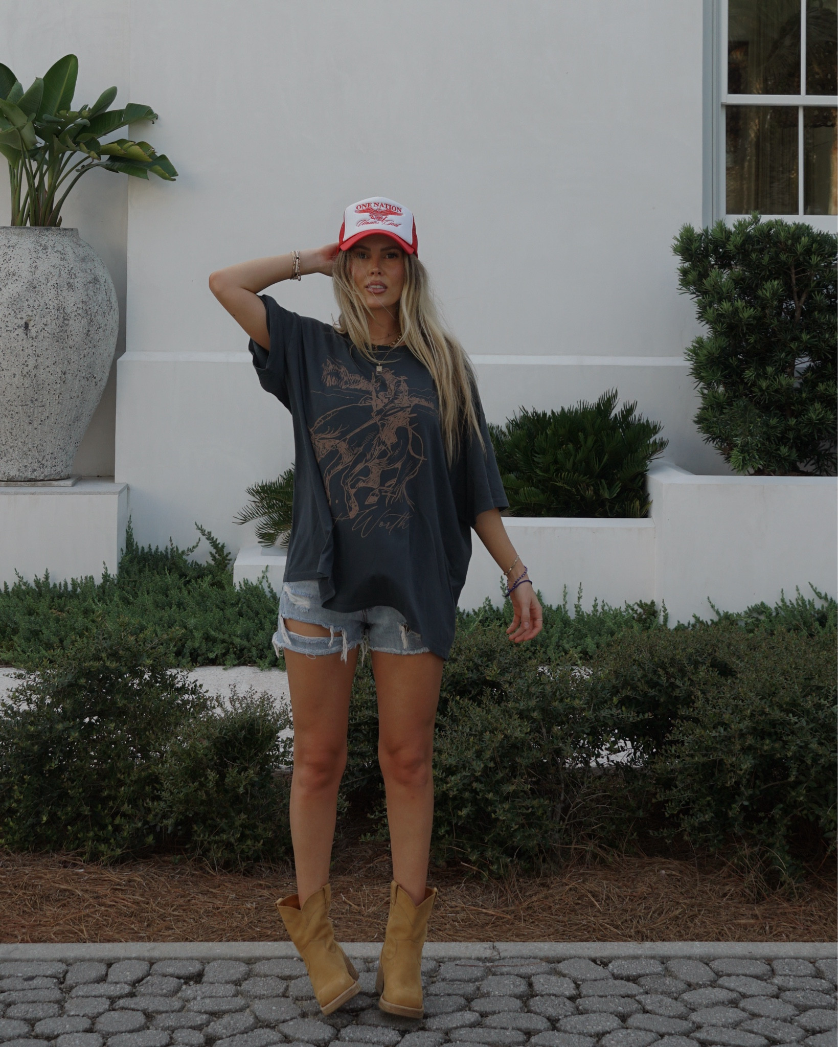 Trucker hat coming soon to temporarylocal.co  🇺🇸 
Graphic tee, country concert outfit, ripped denim shorts, cowboy boots, western style 

#LTKFindsUnder100 #LTKShoeCrush #LTKFindsUnder50