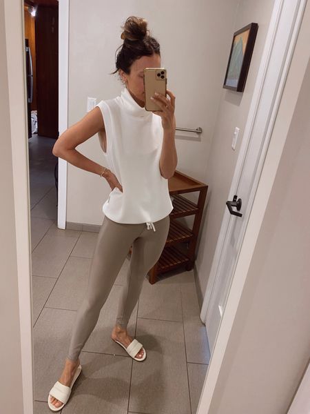 Today’s travel outfit 
Tan leggings
Double soft sleeveless pullover 
Molded footbed sandals 

#LTKstyletip
