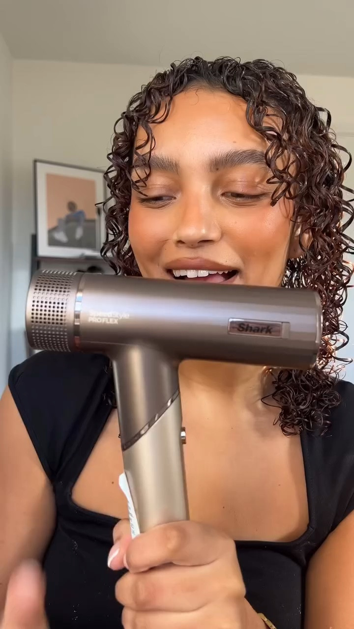 I’ve been using the Shark Speedstyle Pro Flex for MONTHS now. Here are my honest thoughts 💭 

Here’s what I LOVE: 

💕Lightweight/travel friendly yet powerful 

💕Retractable diffuser. Can extend prongs to get into the hair & dry. Also lifts roots for hair volume. 

💕Suitable for all hair types with multiple attachments.

💕Ionising technology gives less frizz and healthy-looking hair

BUT‼️these are also features that my other (previous) Shark Speedstyle hair dryer ALSO shares. So what’s actually new? 

➡️The Scalp shield - I’ve NEVER seen anything like this before! This is mode uses the optimum temperature for scalp protection & dry roots.

➡️Foldable - none of my shark tools fold like this which makes it handy for travelling.

To be completely honest though… I think this hairdryer has been overshadowed by the launch of the Shark FlexStyle (an airstyler AND hairdryer). There IS a £70 price difference but for that extra price you might want to invest in a tool that seems to do it all (I haven’t actually tried yet but looks amazing). 

#hairdryer #sharkbeauty #diffuser #curlyhairroutine