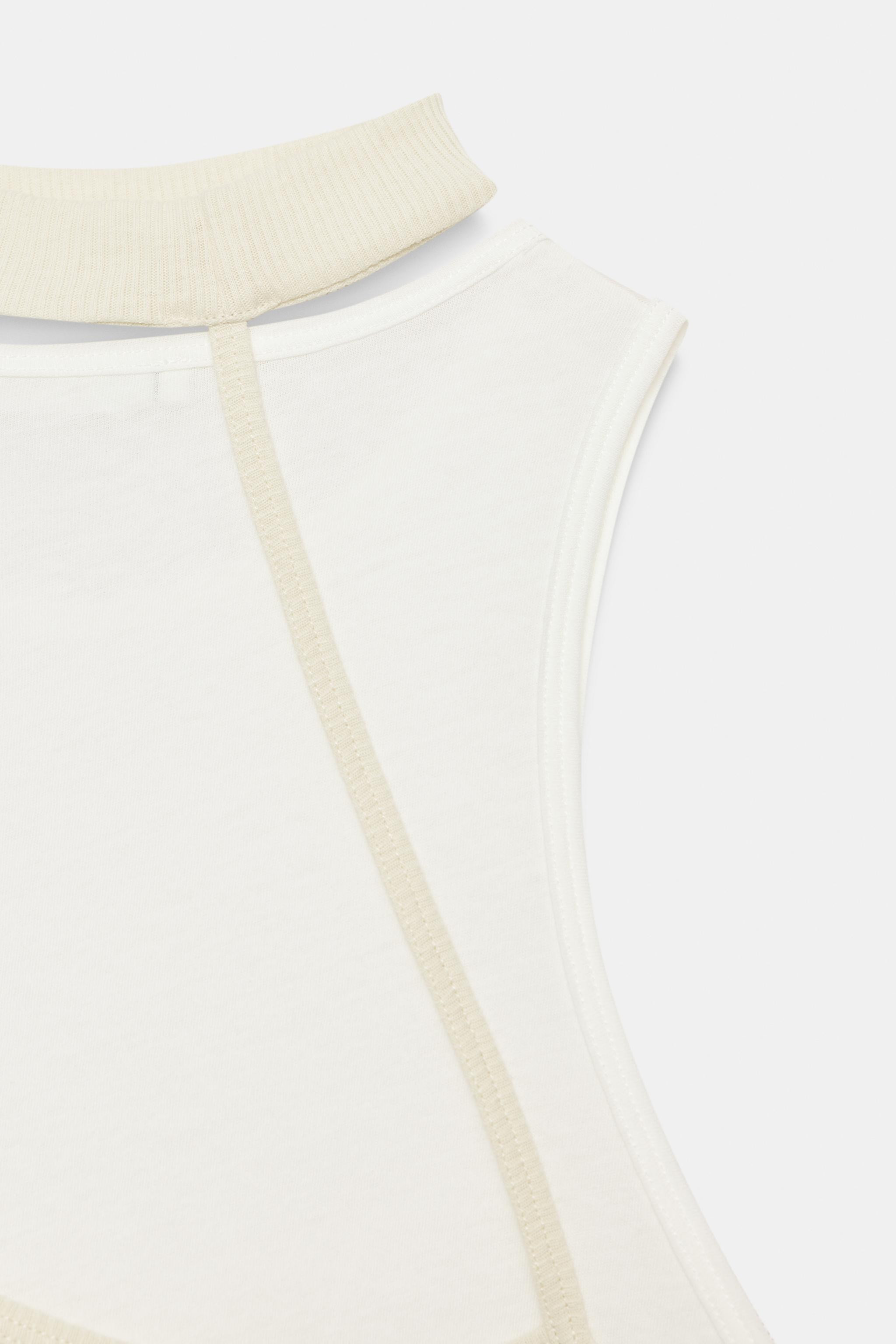 T-shirt crafted from 100% cotton. Features a crew neck with a contrasting choker detail. Sleevele... | Zara US