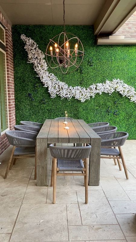 Patio Progress | This space is getting a makeover just in time for the summer! ✨ The topiary wall gives so much more character than just brick!  Will share before and after a once the entire backyard is completed.

#topiary wall
#outdoor living
#patio decor
#outdoor furniture 
#outdoor chairs
#outdoor dining
#ready for summer

#LTKhome