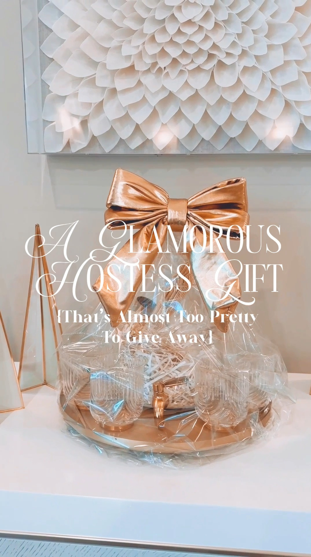 “Gather ‘round, darlings, because today I’m unveiling a showstopper hostess gift that might just steal the Christmas spotlight. Yes, it’s technically a hostess gift (budget-friendly, too!), but trust me, this beauty could easily double as the most glamorous Christmas present for anyone on your list.
The star of the show? A chic Christmas tree-shaped clear dispenser, darling. I filled it with crinkle paper (because presentation is everything), then added fabulous gold and acrylic bar tools, glimmering gold paper straws, and matching stirrers. Naturally, I placed it all on a gold round tray (because, of course, even the tray is part of the gift—how clever is that?).
For the final touch? Four elegant gold-and-glass stemless wine glasses, all wrapped up in clear cellophane and crowned with the most imposingly glamorous gold bow you’ve ever seen. Et voilà, perfection in gift form.
Who wouldn’t be wowed? Ready to recreate this luxe moment? 
Stay chic, always. ✨


#LTKGiftGuide #LTKHoliday #LTKSeasonal