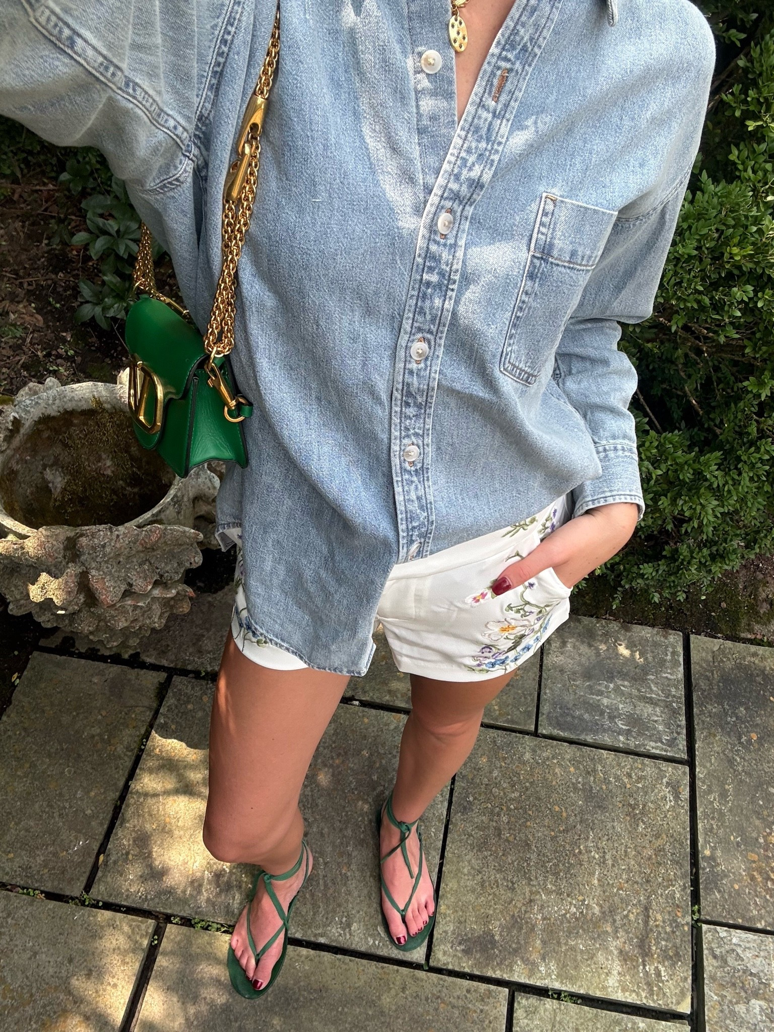 Aritzia denim button down shirt with Alice and Olivia white shorts and green sandals. 

summer outfit ideas, summer outfits women, cute summer outfit, summer fashion 2026, summer outfit inspo, casual summer outfit, elevated casual outfit, chic summer outfit, preppy summer outfit, effortless summer style, everyday summer outfit, weekend outfit ideas, vacation outfit ideas, summer vacation outfit, European summer outfit, summer brunch outfit, summer lunch outfit, cute daytime outfit, transitional summer outfit, end of summer outfit, denim shirt outfit, denim button down outfit, oversized button down outfit, oversized denim shirt outfit, chambray shirt outfit, denim shirt women, button down shirt outfit, button down outfit women, denim and white outfit, blue and white outfit, embroidered shorts, floral embroidered shorts, white shorts outfit, white shorts summer outfit, statement shorts outfit, green accessories outfit, green handbag outfit, green sandals outfit, green bag outfit, strappy sandals outfit, flat sandals outfit, summer sandals outfit, gold jewelry outfit, layered necklace outfit, preppy outfit ideas, feminine casual outfit, feminine summer outfit, coastal chic outfit, coastal outfit, garden party outfit, summer garden outfit, colorful summer outfit, classy summer outfit, trendy summer outfit, Pinterest summer outfit, outfit inspiration women, summer wardrobe inspiration, summer fashion finds, summer outfit links, shop my outfit, shop my look, outfit details, summer fashion finds, women’s fashion finds, summer clothing finds

#LTKTravel #LTKTall #LTKootd