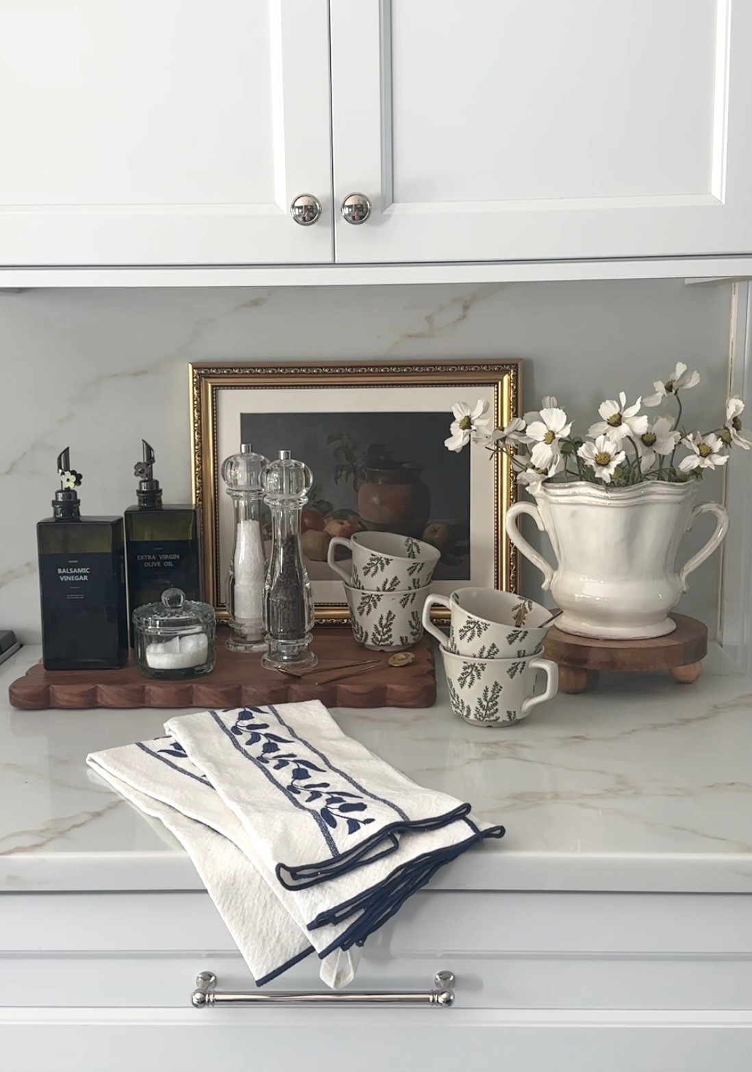 Pretty kitchen styling and accessories! Love my new vase on sale, cups with spoons, wood board, salt and pepper mills, artwork, condiment jars, tea towels, sale cellar and more! Amazon, McGee & Co, Williams Sonoma, etú home

#LTKHome #LTKSaleAlert