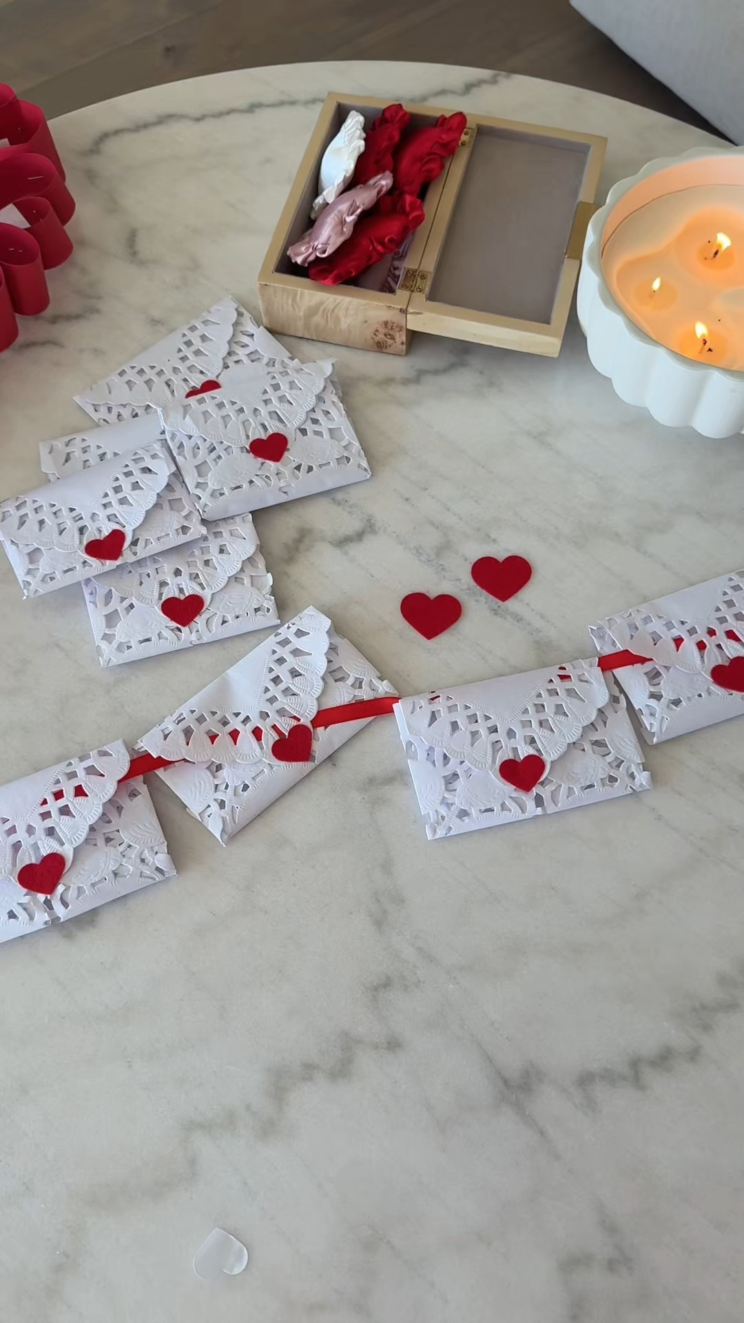 Love Letter DIY! I grabbed extra large paper doilies, red heart stickers, and red ribbon to create this satin look. I’m obsessed with how easy and cute this turned out! 