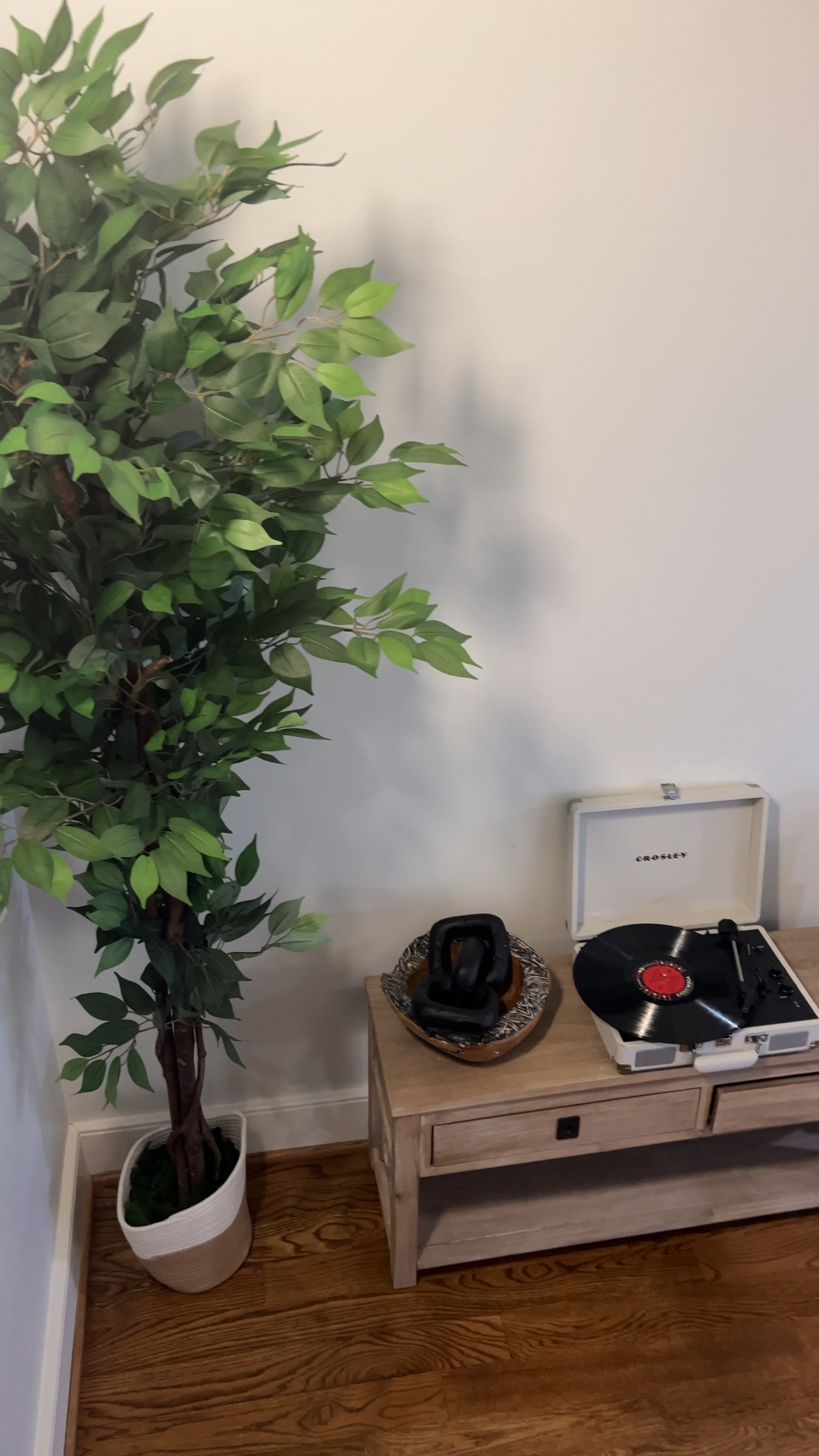 This area in our stairwell stayed empty for way too long. Love that I was able to add a little decor to the place and the record player fits perfectly. 

#LTKfindsunder100 #LTKhome