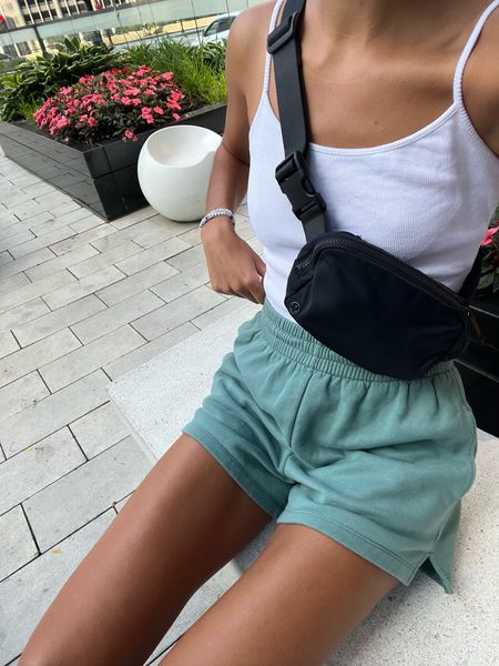 causal outfit ! 

white crop top tank: princess Polly 
green sweat shorts: abercrombie
Crossbody: lululemon 
new balance 990v5