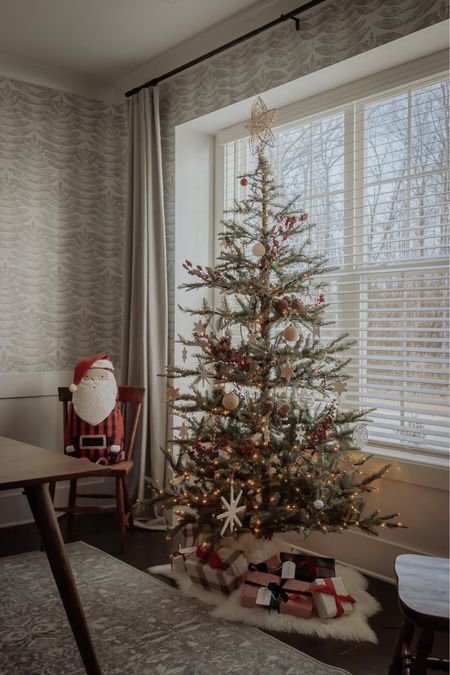 King of Christmas tree, with a santa doll and sheepskin throw tree skirt 

#LTKSeasonal #LTKhome #LTKHoliday