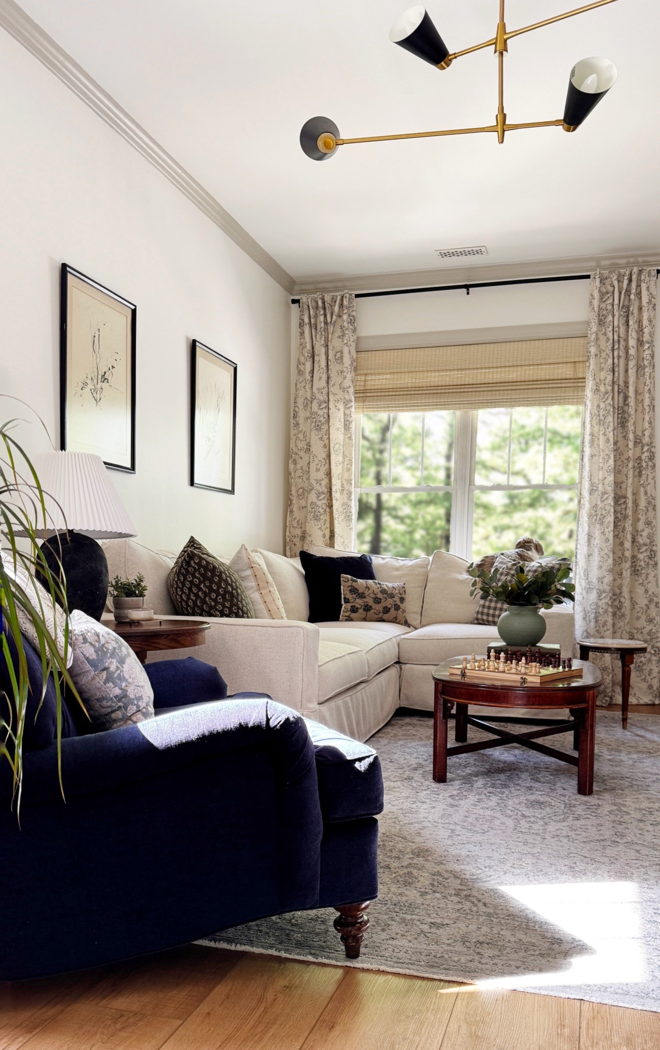 Neutral living room with linen floral curtains, PB Comfort sectional & Carlisle dupe arm chair  

#LTKHome
