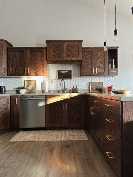 Walnut cabinets. Dark wood kitchen. Budget kitchen decor. Brass kitchen hardware. 

Rug: Loloi Chris Loves Julia x Polly Collection POL-03 Straw / Ivory

#LTKhome #LTKstyletip