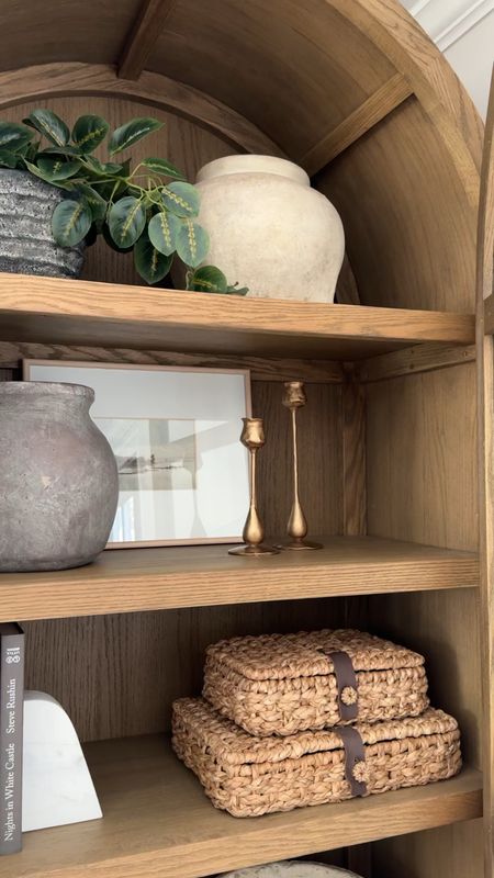 Neutral styling, shelf decor, neutral home decor, candle sticks, decorative boxes, book ends, faux plants. styling book, arched cabinet, wood cabinet 

#LTKHome #LTKStyleTip #LTKVideo