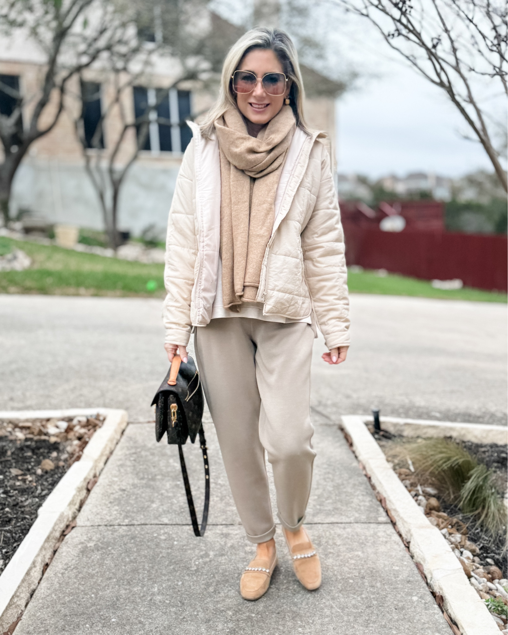 Bundled up in beige to head out to my orthodontist consult. Long story short-I’m starting Invisalign in April to fix a pretty bad overbite that’s wearing down my front teeth. Anyway…swipe right to see the whole outfit. I felt put together and comfortable for an appointment I was honestly pretty nervous about. Feeling a lot better about the plan, especially since I got a lot of encouragement from so many of you!

As far as the outfit goes, I’m wearing a size small in everything and you can use code MARNIExSPANX to get 10% off my top and pants. 

#airessentials #casualoutfit #fashionover40 #fashionover50 #lightweightpuffer #cashmere #loafers 

#LTKover40 #LTKSeasonal #LTKshoecrush
