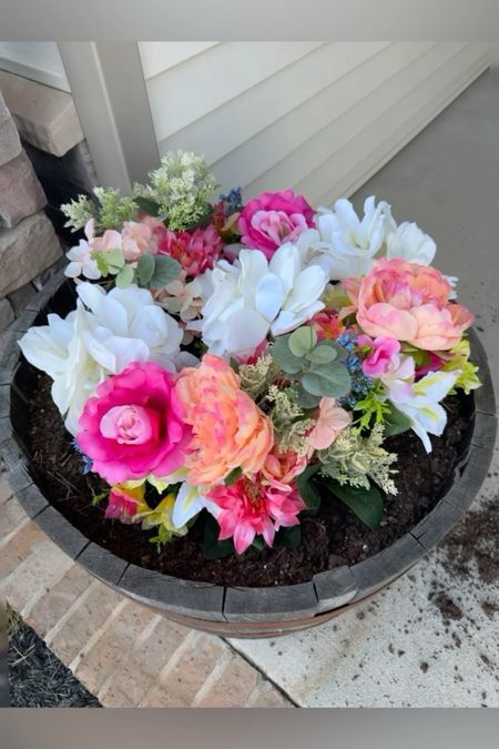 The best kind of flowers are the ones you don’t have to remember to water🌸🌷
I planted fake flowers in this barrel planter on my front porch, and they look so pretty! And the best part is, I don’t have to remember to water them. 

#LTKSeasonal #LTKHome #LTKSaleAlert