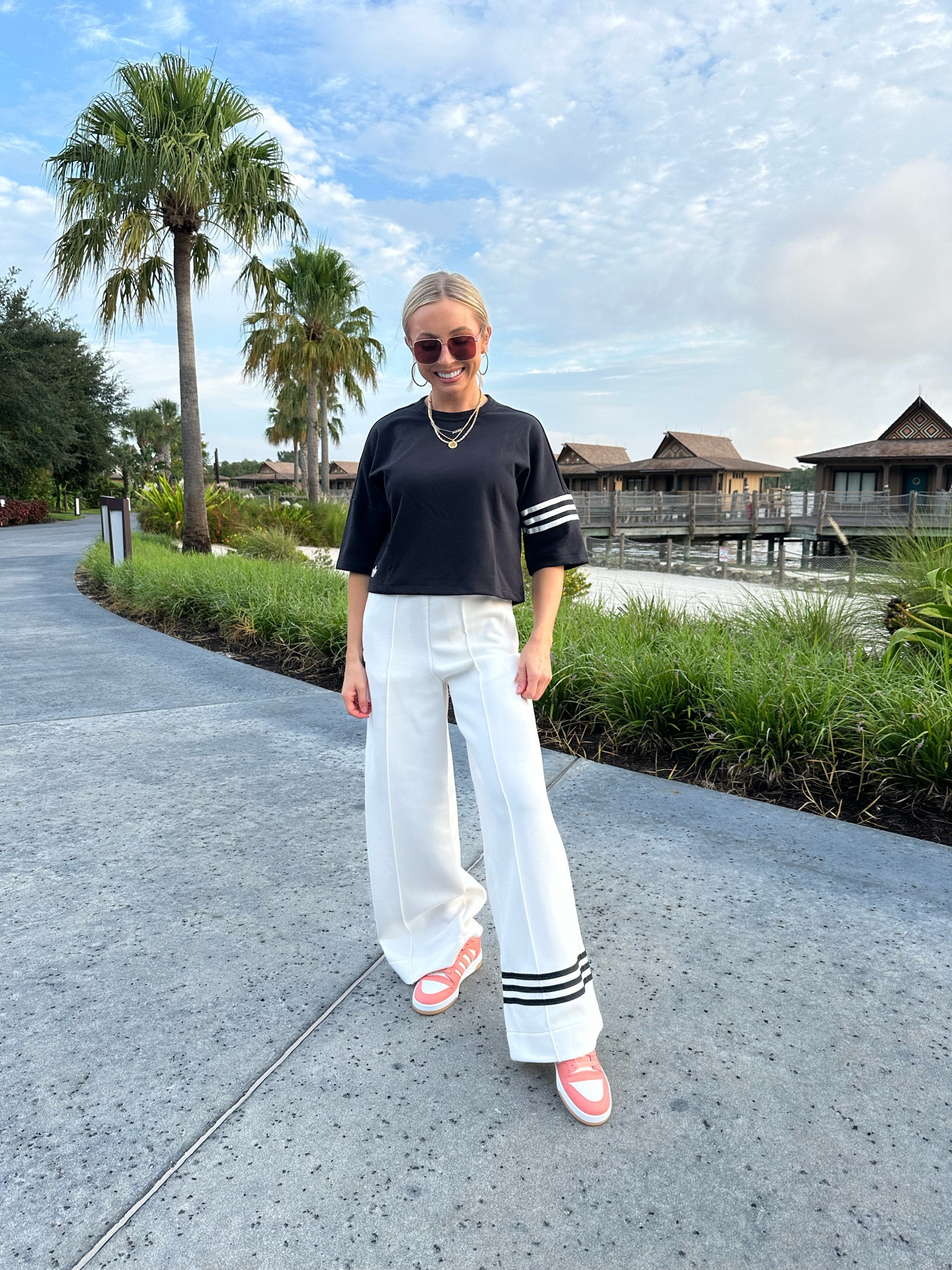 Travel outfit inspo! Use code LTKCON for 30% off my @adidas tee + track pants! Wearing a size XS in both. Both pieces are so versatile. You can literally pop on heels and wear these pants to the office. Also, my shoes are already on sale! #createwithadidas #adidaspartner 

#LTKShoeCrush #LTKStyleTip #LTKTravel