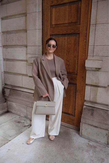 Neutral spring outfit 
Cream wide leg trousers (River Island size 10)
Beige bodysuit (Stradivarius size small)
Reona oversized blazer (Linked on IG under April Highlights)
River island ballet flats
Cafune Bag 
Sunnies linked 

#LTKeurope #LTKmidsize #LTKworkwear