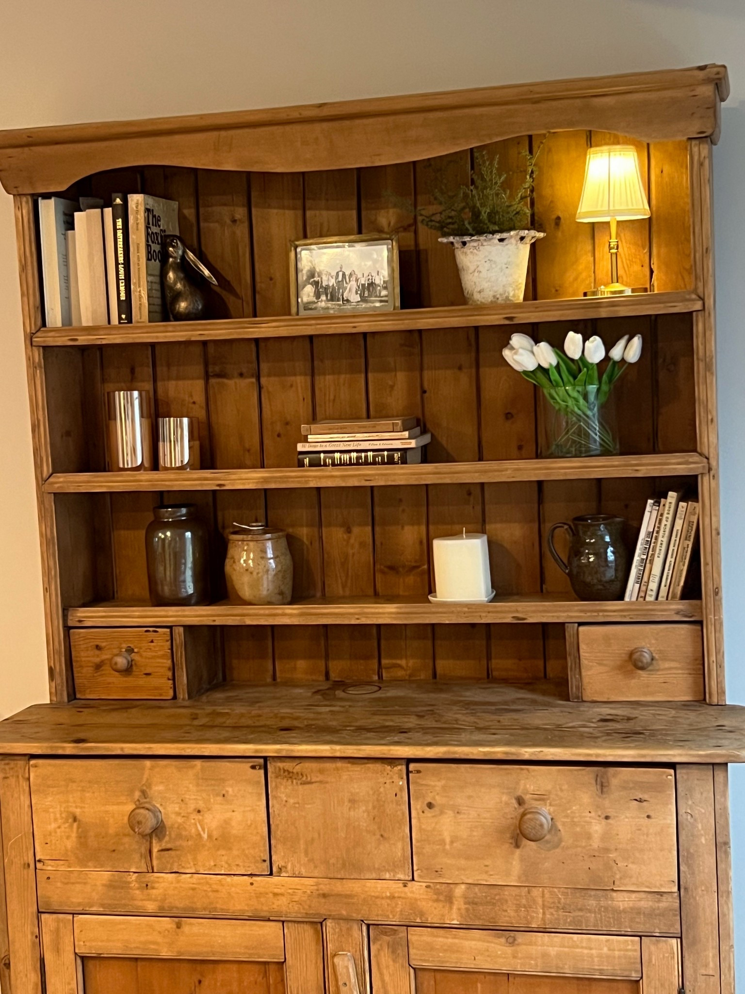 Hutch styling | spring decor | Easter decor | book ends | books | lamp | mini lamp | tulips | florals | stems | spring flowers 

#LTKHome #LTKFindsUnder50 #LTKSeasonal