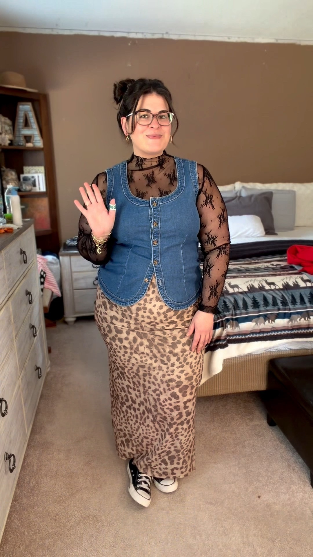 Denim vest outfit + leopard maxi skirt styling 🐆

If you’re searching for a leopard skirt outfit, midsize date night outfit, or casual concert outfit, this layered look is such an easy way to style statement pieces for everyday wear. I paired a fitted denim vest with a sheer lace long sleeve layering top and a satin leopard print maxi skirt for a trendy but wearable outfit.

This is a great midsize and curvy outfit idea that mixes textures while still being flattering and comfortable. The structured denim vest helps define the waist while the flowy leopard maxi skirt keeps the outfit feminine and effortless. Styled with classic black Converse for a casual street style vibe.

Perfect for:
• Date night outfit
• Concert outfit casual
• Girls night outfit
• Weekend outfit idea
• Winter to spring transition outfit
• Layered outfit inspiration

Shop this denim vest outfit, lace layering top outfit, leopard print skirt outfit, and casual sneaker outfit all linked here.

#LTKPlusSize #LTKMidsize #LTKootd