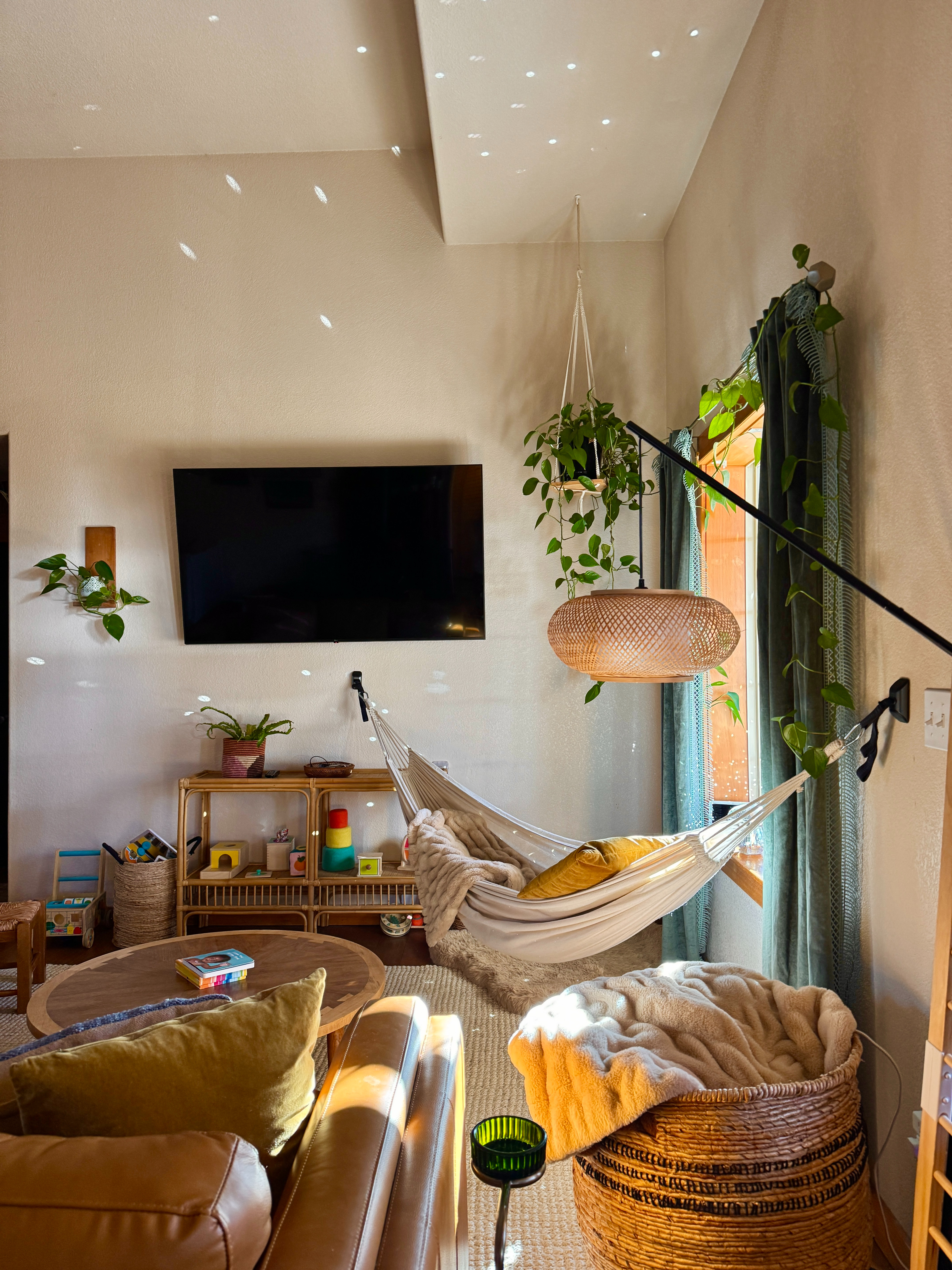 This little corner of our living room might be my favorite! Warm textures, hanging plants, and a cozy hammock make the space feel calm but still lived-in. 

 #LTKdayinmylife #LTKHome