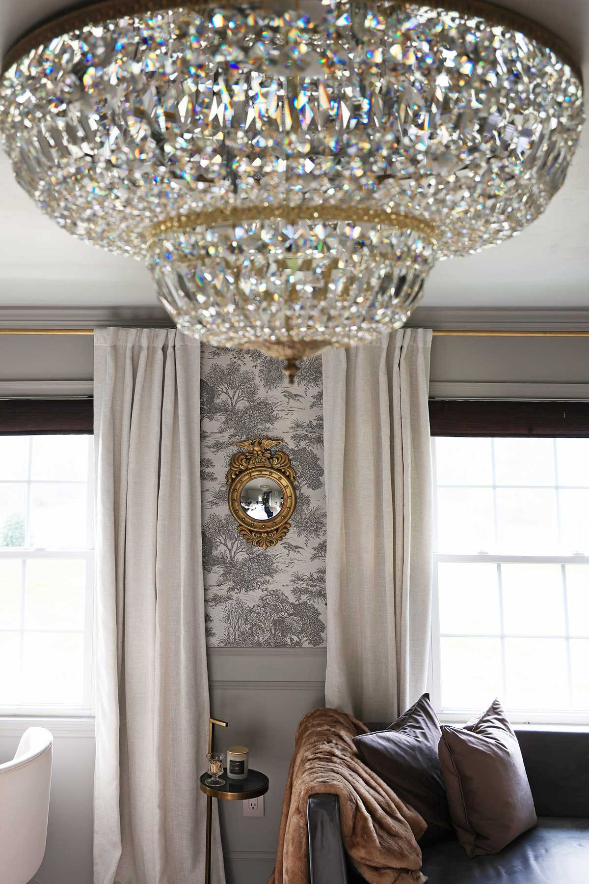 French inspired bedroom styling | Gorgeous black and white monochromatic French toile wallpaper | Large flush-mount ceiling chandelier |
Mocha colored throw pillow covers | Fur throw | And gold mirror. 

 #LTKHome