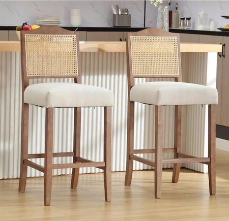 Upholstered and wood barstools with wicker rattan cane backingg
Bar stool
Counter stools
Kitchen island seating 

#LTKFamily #LTKSaleAlert #LTKHome