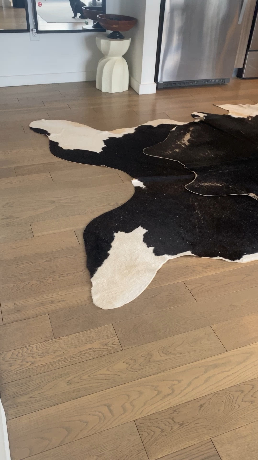 I love decorating with cowhides. We got two and layered them to make one XL rug 

#LTKHome #LTKVideo #LTKStyleTip