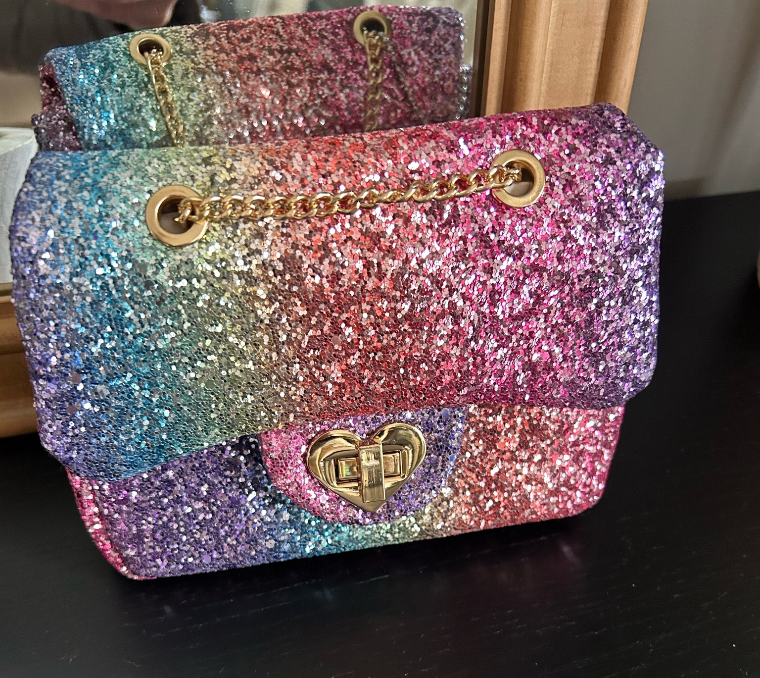Adorable rainbow glitter purse for little girls. Chain is adjustable to be worn different ways. Comes in multiple color options. Makes a great gift!

#LTKkids