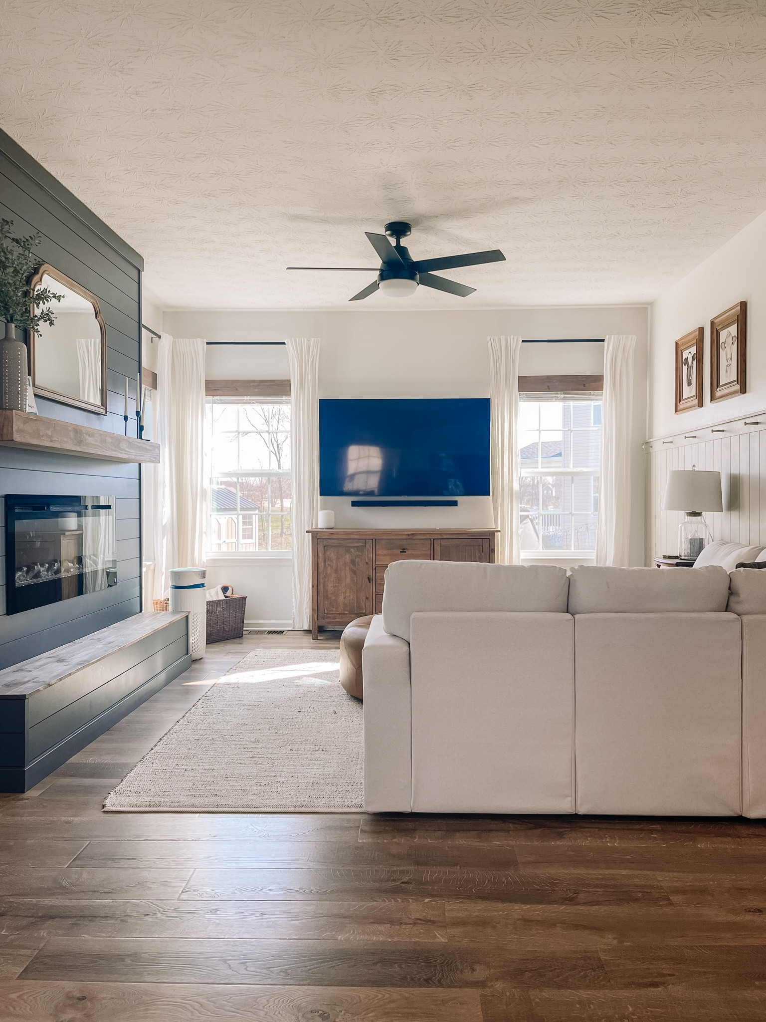 Loving our cozy living room complete with our DIY fireplace. Making it the perfect place to curl up with a good book or have family movie night. 

#livingroom
#fireplacedecor

#LTKfamily #LTKFind #LTKhome