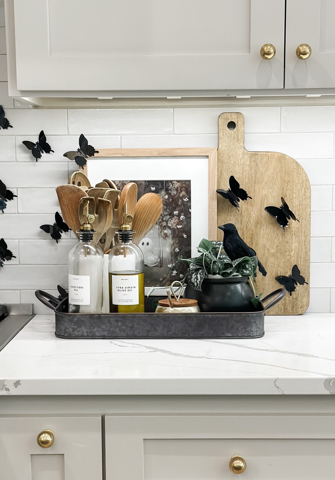Loving this neutral palette ✨ A classic, timeless way to style the kitchen for fall. I linked the utensils, bottles, and those chic black butterflies that add the perfect seasonal touch. 

#LTKFindsUnder100 #LTKSeasonal #LTKHome