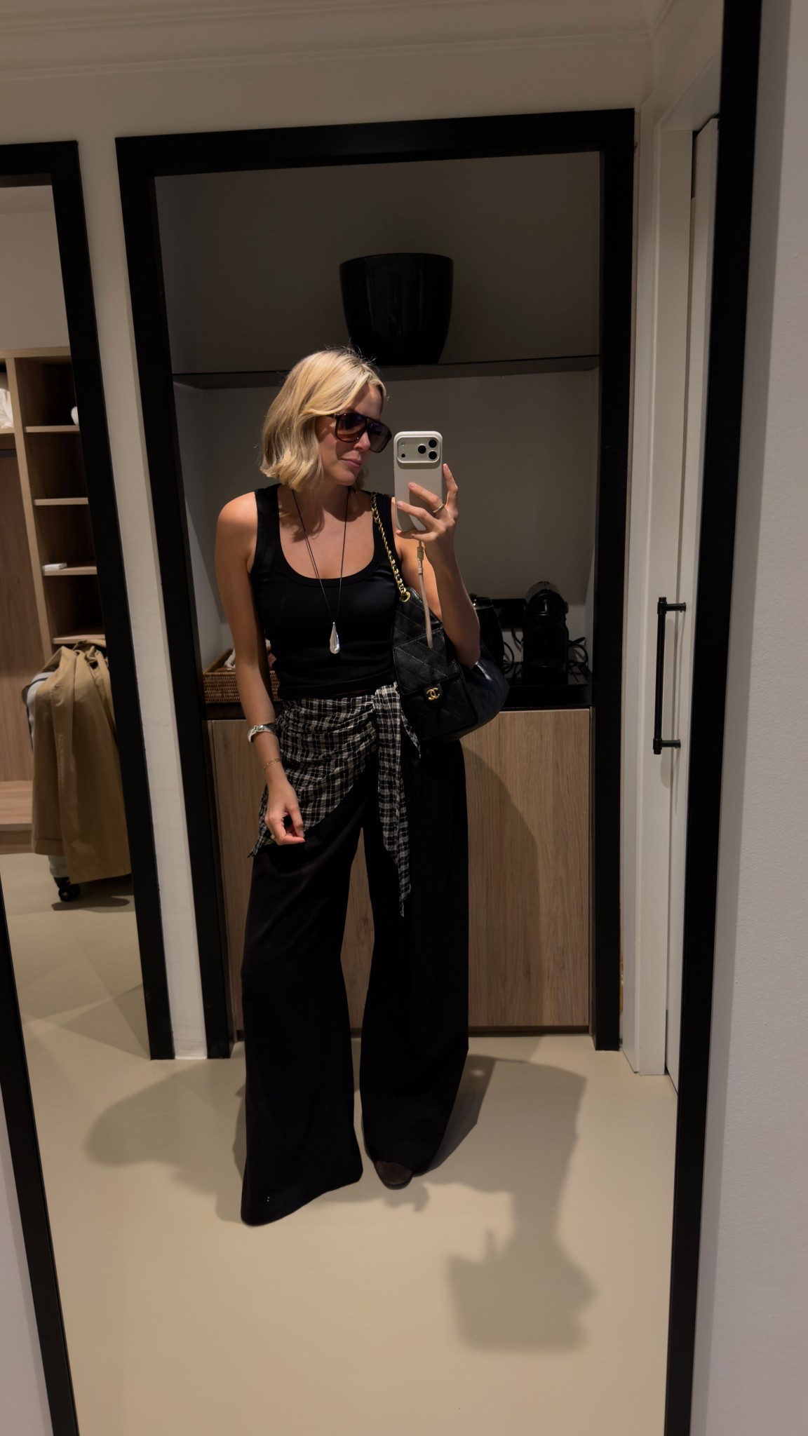 Spring outfit, city break outfit, all black outfit, black vest, black trousers, long pendant shell necklace 

#LTKspring #LTKuk #LTKeurope