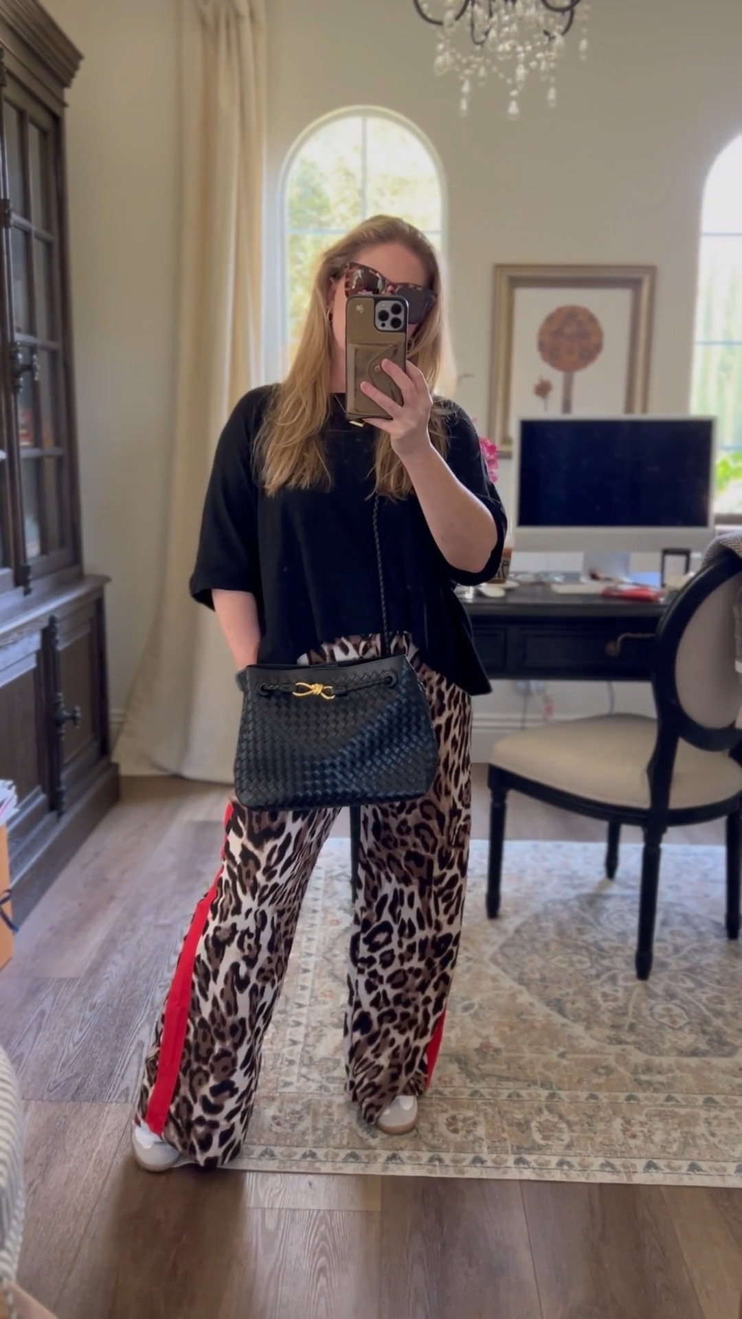 OOTD • Totally stepped out of my comfort zone with these leopard-striped wide leg pants—and I’m so here for it. 🔥 Comfy, bold, and surprisingly easy to style. Just throw on a black or white tee, or go wild with a graphic one. 🐆🖤 • This handbag is as functional as it is chic — wear it crossbody for everyday ease, or switch to the sleek short handle (hidden inside!) for a dressier vibe. Plus, it comes in a range of colors. 

#LTKStyleTip #LTKShoeCrush #LTKItBag