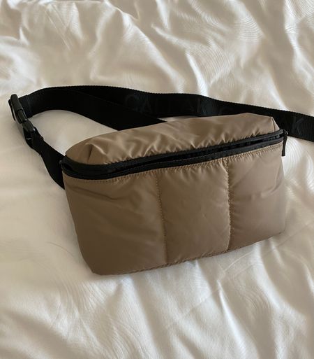 Belt bag. Puffer belt bag. Puffy belt bag. I use this for travel with the matching duffel bag and mini roll on bag. Lightweight. Zippered pockets inside  

#LTKtravel #LTKover40 #LTKfindsunder100
