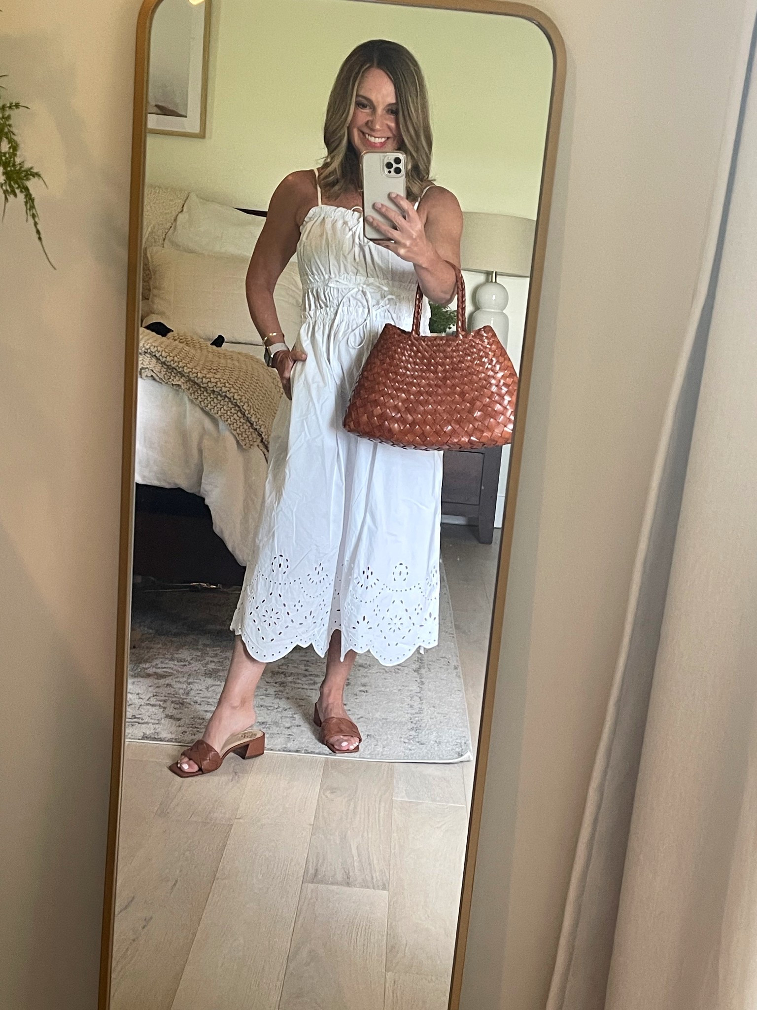 This $14 dress is possibly my best budget find EVER! Love the bow and eyelet detail, adjustable waist and straps and it has pockets! 
Fully stocked in all, tts, great for petites!! Wearing XS. 
#petite #LTKOver50

#LTKFindsUnder50 #LTKSaleAlert #LTKPetite