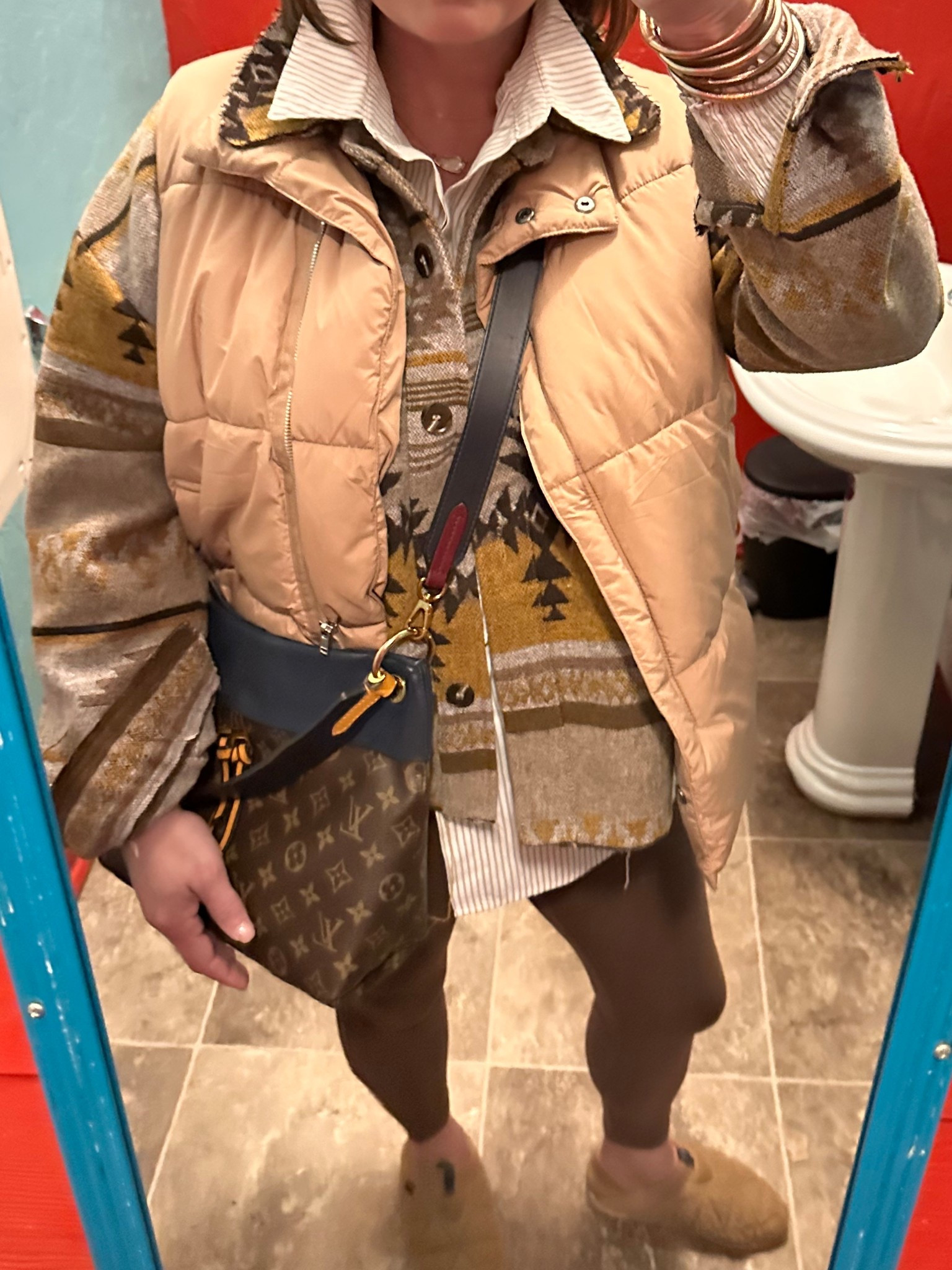 This cozy layered outfit was perfect for a casual night out on our ski trip. ❄️ When temperatures drop, layering is the easiest way to stay warm and still look put together.

I started with a striped button-down shirt and layered on a western-inspired Aztec print shacket, then added a neutral puffer vest for extra warmth. Paired it with comfy brown leggings, cozy slippers, and my classic Louis Vuitton crossbody bag to keep everything casual but polished.

It’s the kind of outfit formula that works for travel days, mountain towns, casual dinners, or running errands in cold weather.


western inspired outfit, aztec print shacket, neutral puffer vest outfit, cozy winter layers, mountain town outfit, ski trip outfit, casual winter travel outfit, striped button down layering, brown leggings outfit, cozy casual style, winter layering ideas, comfortable winter outfit


#LTKootd #LTKOver40 #LTKMidsize