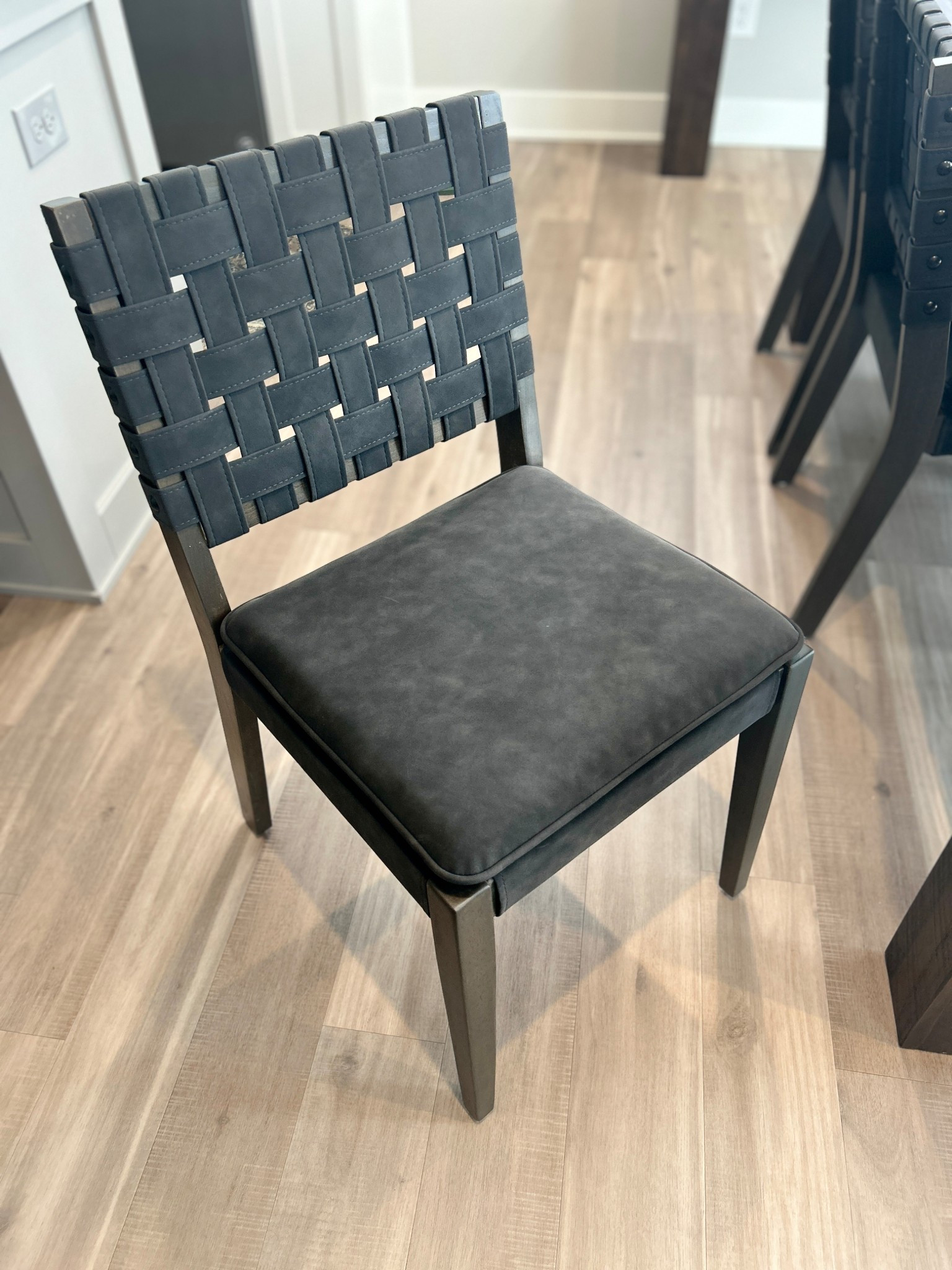 Love our new black woven dining chairs from Nathan James! The quality is amazing, and you can sit in them for hours around the table! 

#LTKHome