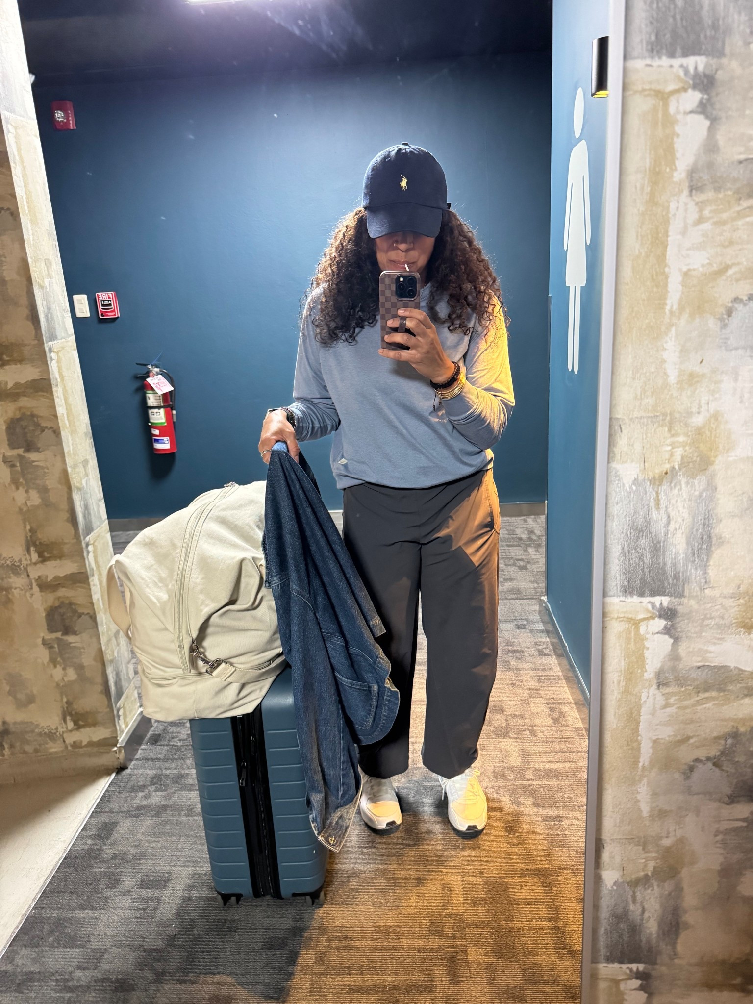 Travel outfit with a 🍭🤪
If you’ve been considering these pants let me help you decide 
No ironing 
Look great with heels, sandals or for Athleisure think of the many looks you can create. ☺️
Bag @loandsons
Pants @Ruti use code happygocurly15
Sneakers @nike tts
Halo long sleeve @Vuori US size down it runs big and is roomy. It is a thicker material than the daydream. It’s essentially a sweatshirt. 
Suitcase @away the carryonflrx 

#LTKActive #LTKTravel