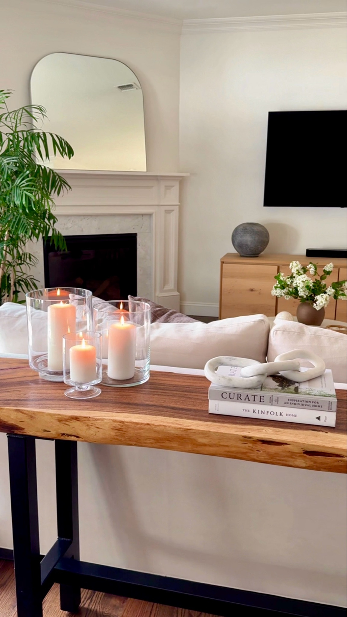 A One of my favorite styling tricks is layering glass hurricanes with candles for instant warmth. This $20 Amazon vase fits right in and works beautifully as a candle holder year-round. #amazonhome #homedecor #candlestyling #consoledecor #neutralhome #timelessdecor

#LTKHome #LTKHome #LTKSaleAlert #LTKSeasonal