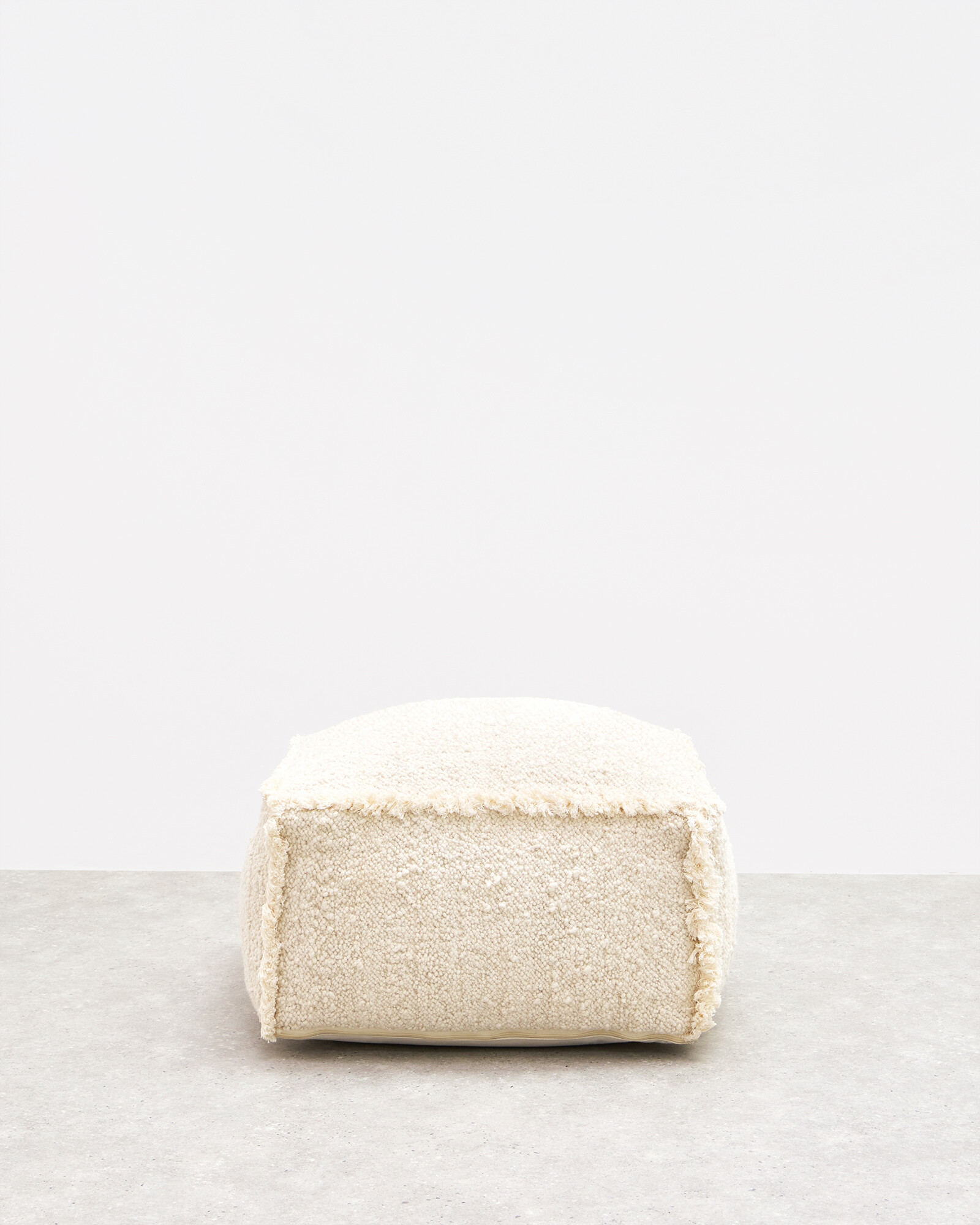 Issey White Boucle Fringed Pouffe Footstool | Oliver Bonas (Global)