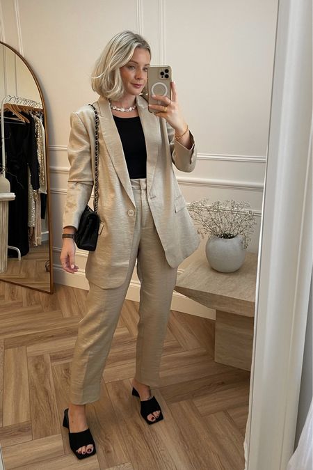 festive partywear outfit inspiration. Gold sparkly suit - blazer & trousers both from phase eight. I’ve kept the rest of the look simple with black heeled mules, a black tank top, Pearl necklace from Astrid & miyu and black Chanel handbag.

#LTKstyletip #LTKHoliday #LTKSeasonal