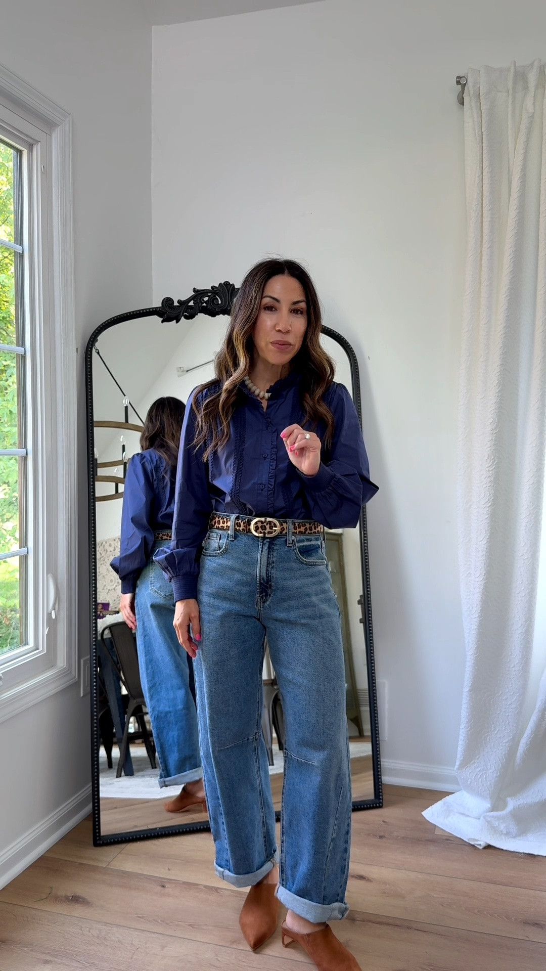 Small navy blue button-down shirt. 25 barrel jeans.

#LTKOver40 #LTKPetite