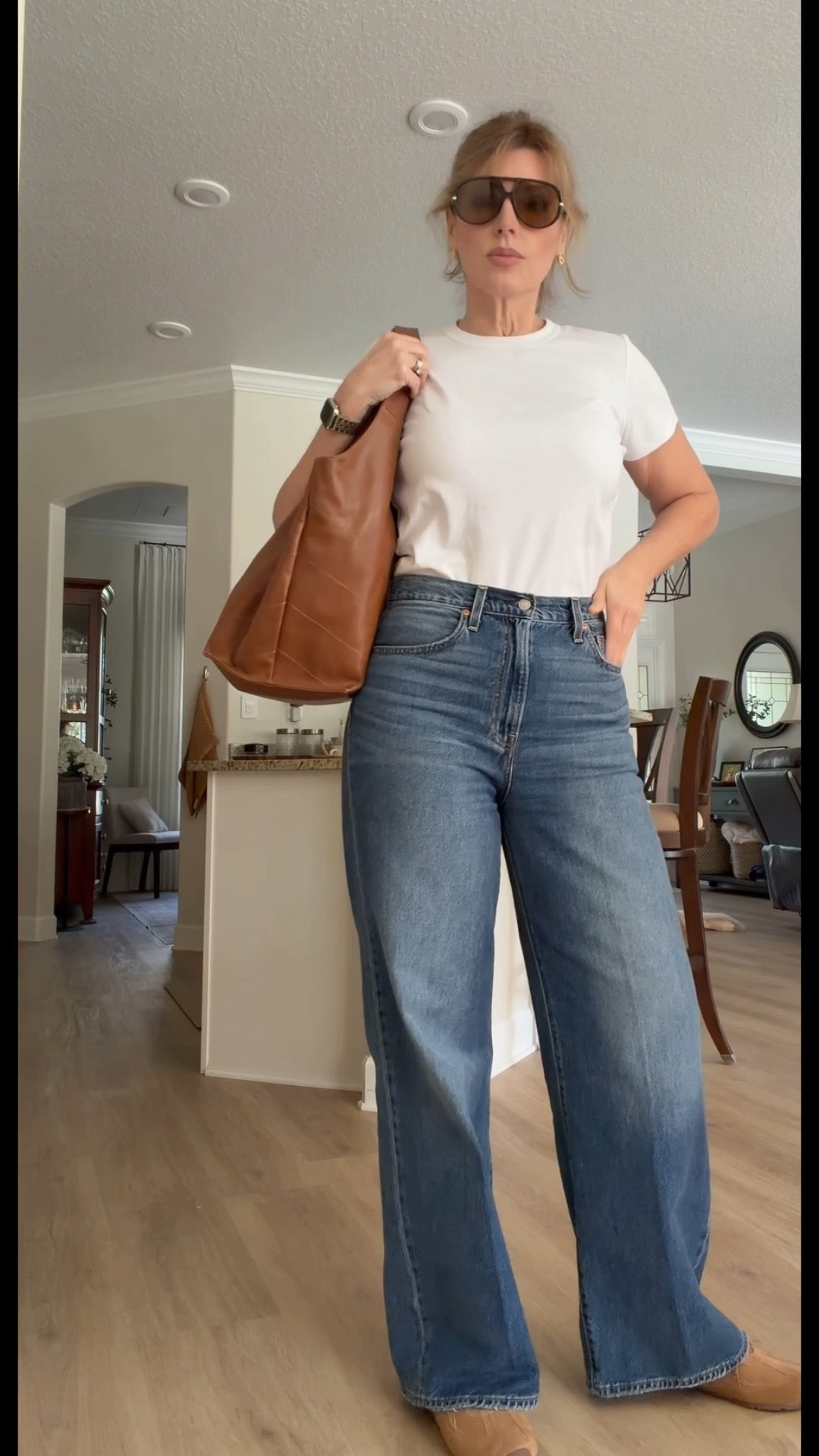 The easiest outfit that always looks elevated 🤍

This is my go-to formula when I don’t want to think—but still want to look put-together:

• Classic white tee (clean, fitted, timeless)
• Levi’s Ribcage wide leg jeans (size 31x32)
• Brown leather tote + matching shoes (pulls everything together)

The high-rise + wide leg gives that long, lean line, and the warm brown accessories make it feel intentional—not basic.

It’s giving 90s off-duty, quiet luxury, effortless confidence.

Wear this for:
✔️ errands
✔️ casual workdays
✔️ travel
✔️ everyday elevated style

Save this—because this outfit never fails.

#ltkdenim #levisribcage #minimalstyle #effortlesschic #everydaystyle

#LTKMidsize #LTKSaleAlert #LTKTall