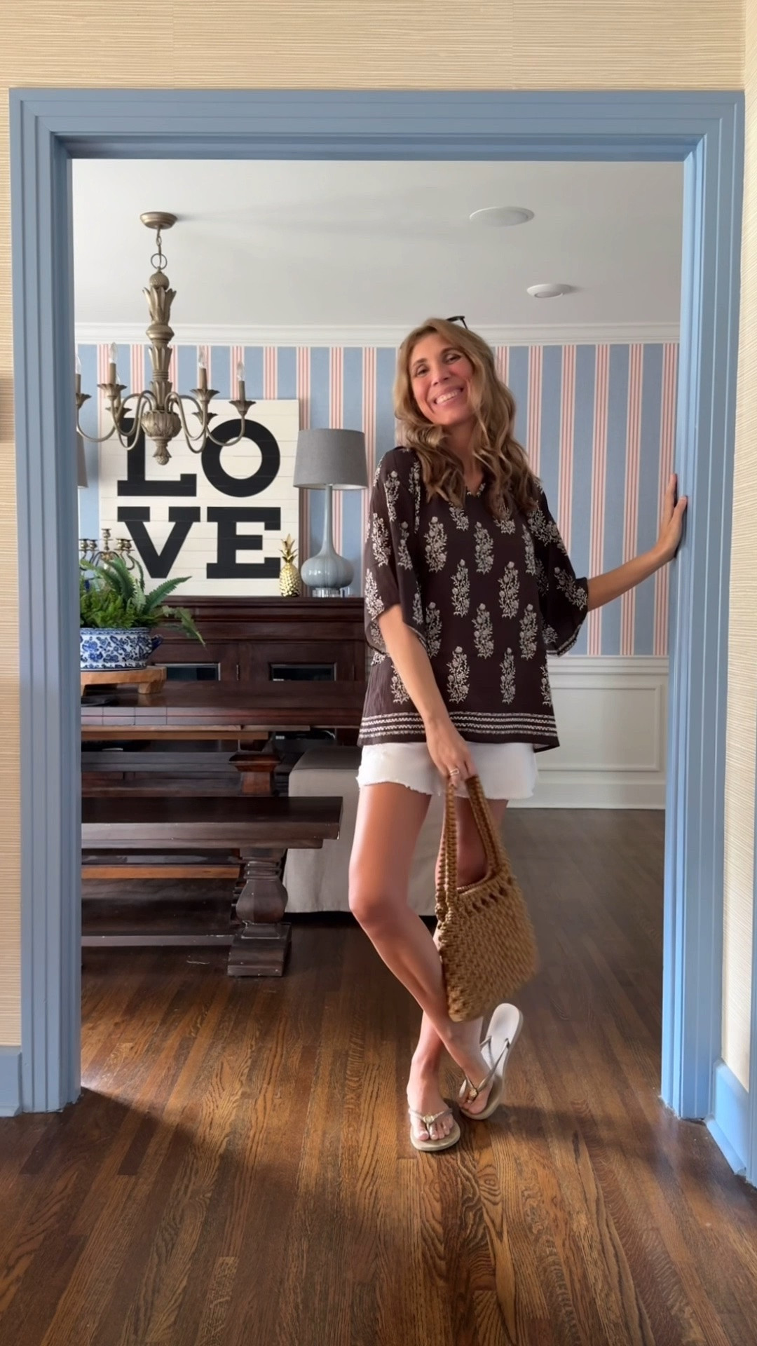 Just a casual summer outfit for errands and hanging around the house -
Cute little Amazon tunic (wearing a small), white denim shorts, my Havainas flip flops, and a vintage straw bag.

#LTKOver40 #LTKootd