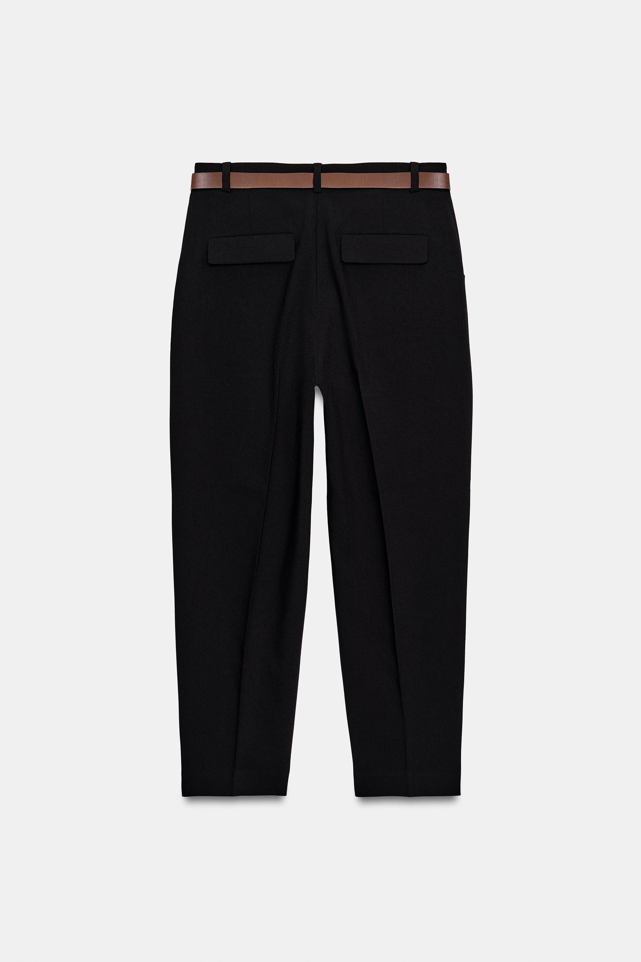 Mid-waist cropped trousers with a belt and front pleats. Featuring front pockets and false flap b... | Zara UK