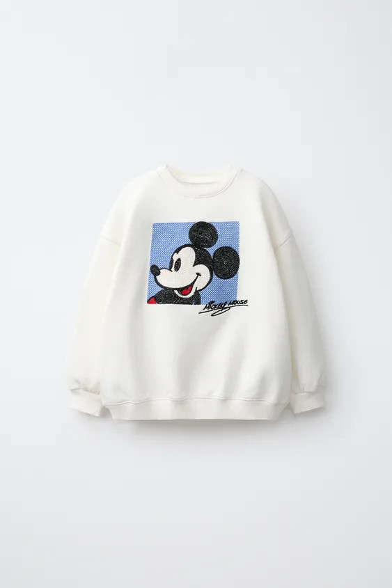 Sweatshirt mit Rundhalsausschnitt und langen \u00c4rmeln. Rippenb\u00fcndchen. Gestickter Micky M... | Zara DE