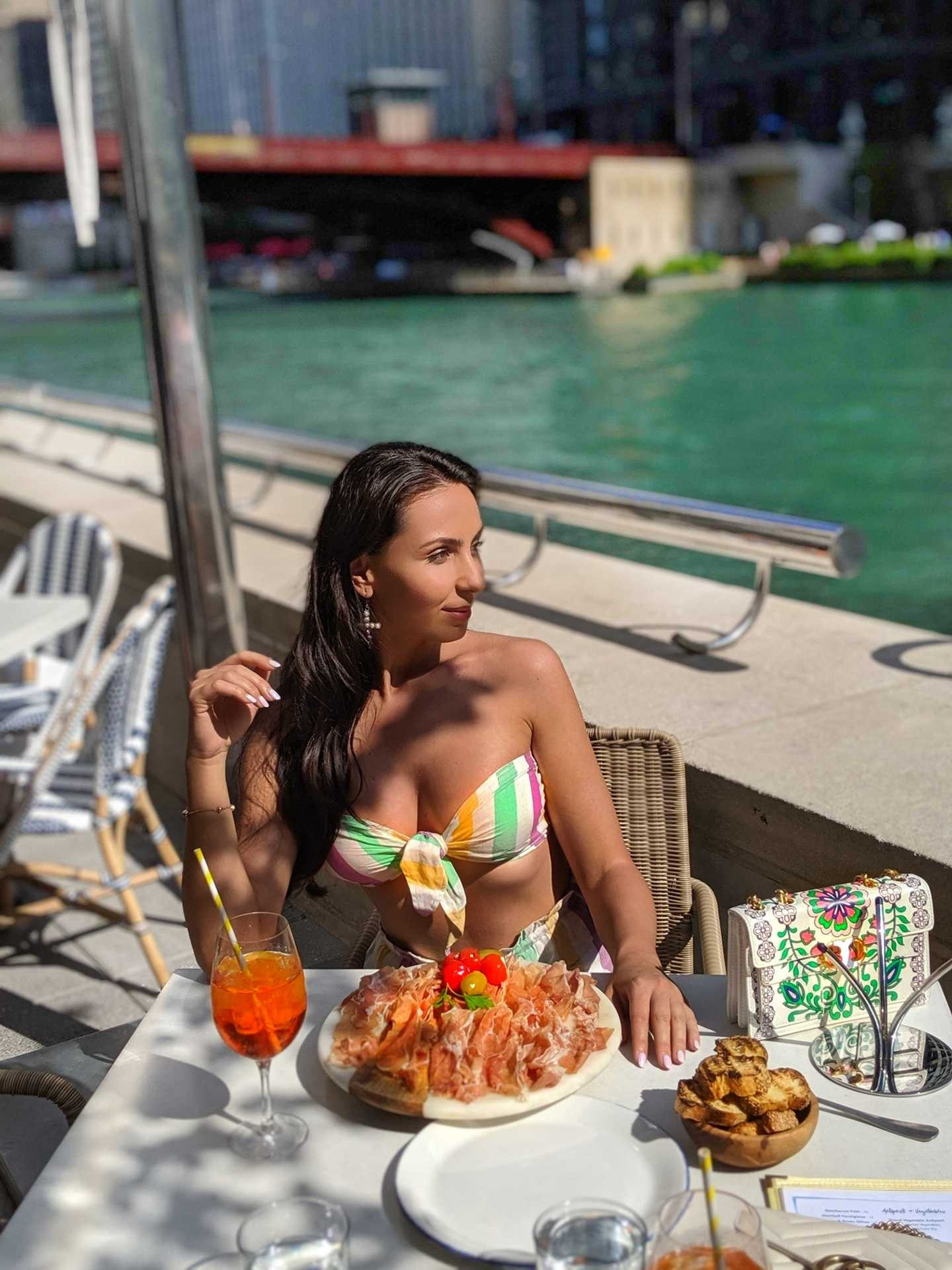 Sunshine, sips, and a stunning view! Loving this summery, vibrant look perfect for lunch al fresco. That tie-front bikini top is a total must-have for your next warm-weather outing. Tap to shop my chic swimwear and accessories! #SummerStyle #OOTD #Swimwear #BikiniTop #AlFresco #VacationStyle #ShopTheLook #FashionInspo 

 #LTKHoliday #LTKdayinmylife #LTKSeasonal