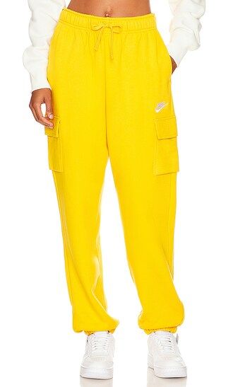 NSW Club Cargo Sweatpant in Yellow Ochre & White | Revolve Clothing (Global)
