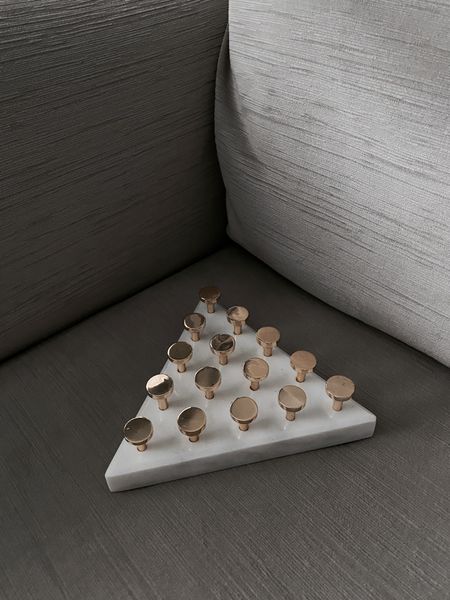 This Marble Triangle Peg Solitaire game is over 50% off!

Add it to your coffee table for a luxe look and also to give your guests something to play with!

#LTKhome #LTKunder50 #LTKsalealert