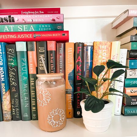 Bookshelves, books, bookshelf, iced coffee, glass, sunflowers, fake plant, shelf decor, coffee tumbler, glass mug, sunflower mug

#LTKGiftGuide #LTKhome #LTKunder50